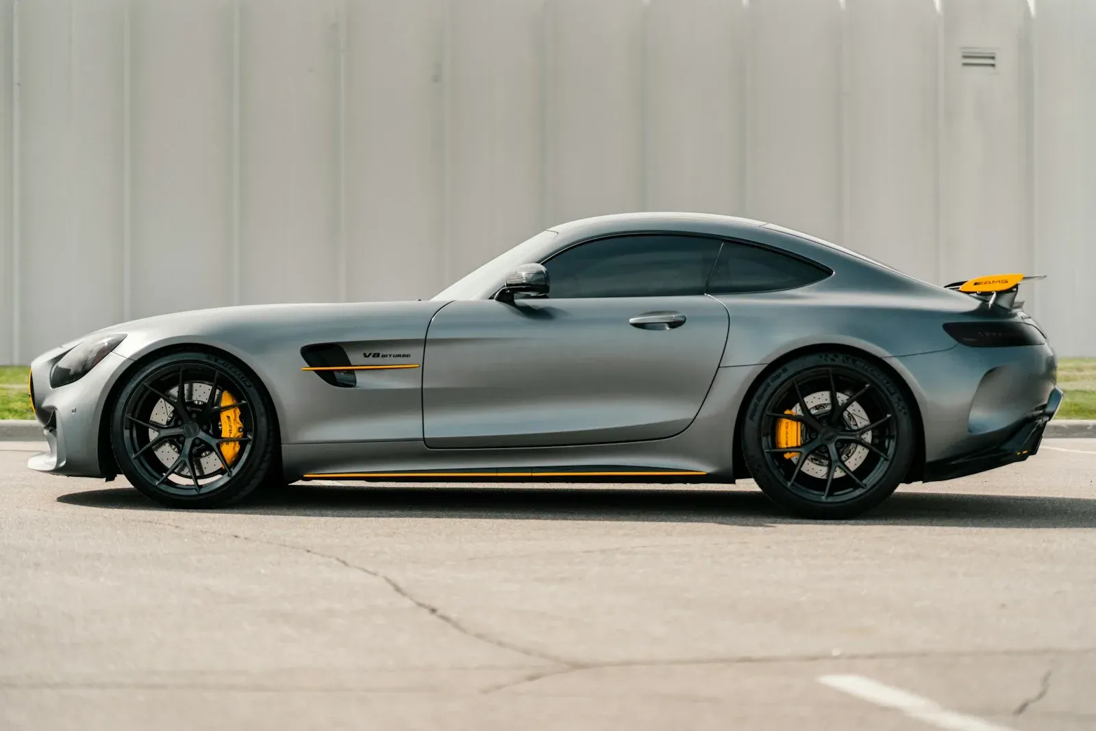 A silver Mercedes-AMG GT R in full side profile.